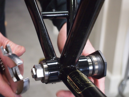 Two Phil Wood bottom bracket tools in use