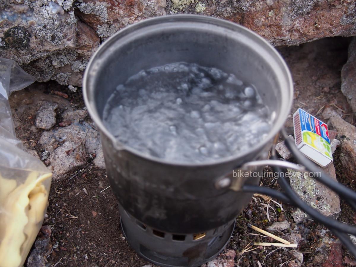 Small pot boiling with alcohol stove